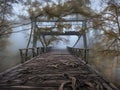 abandoned bridge with fog in the forest
