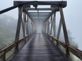 abandoned bridge with fog in the forest