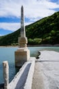 Abandoned bridge going underwater near water dam Royalty Free Stock Photo