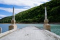 Abandoned bridge going underwater near water dam Royalty Free Stock Photo