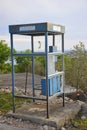 Abandoned and broken public telephone booth