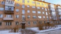 Abandoned building with broken windows in winter