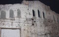 Abandoned building. darkness and horror. background of an old building with windows. White umbrellas. dark sky.