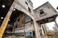 Abandoned building with debris in the city after the war. Broken house on ruin demolishing site after destruction Royalty Free Stock Photo