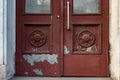 Abandoned building doorway details. Grunge textures of peeling painted surface Royalty Free Stock Photo