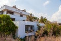 Abandoned building exterior view of Hotel in the Turkish village of kemer with broken windows and overgrown plants Royalty Free Stock Photo