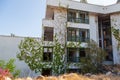 Abandoned building exterior view of Hotel in the Turkish village of kemer with broken windows and overgrown plants Royalty Free Stock Photo