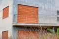 Abandoned Building Facade of a Vacation Home with Bricked-in Windows and Doors Royalty Free Stock Photo