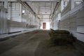 Abandoned building. farm shelter in the barn with haystacks.  Inside a Barn for Farm Animals like Cows or Horses. Interior of Old Royalty Free Stock Photo