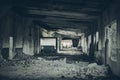 Abandoned building interior, ruins of industrial factory, spooky scary dark corridor, horror scene Royalty Free Stock Photo