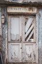 Abandoned building with old retro doors. Clouse-up of a very old weathered wooden door. Royalty Free Stock Photo