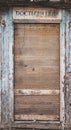 Abandoned building with old retro doors. Clouse-up of a very old weathered wooden door.