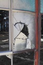 Broken and cracked industrial windows in metal frames Royalty Free Stock Photo