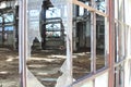 Broken and cracked industrial windows in metal frames Royalty Free Stock Photo