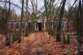 An abandoned building in a state of disrepair in a wooded area. The facade of an abandoned kindergarten in the Chernobyl Royalty Free Stock Photo