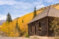Abandoned building among the yellow aspen trees in the Sun Juan Mountains of Colorado Royalty Free Stock Photo