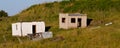 Abandoned buildings on hillside