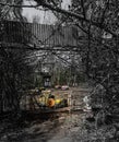 abandoned bumper cars in ruined amusement park in Pripyat city, Exclusion zone of Chernobyl, Ukraine, Eastern Europe Royalty Free Stock Photo