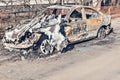 Abandoned and burnt-out car.