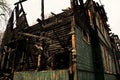 The abandoned burnt-out wooden building