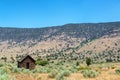 Abandoned Cabin with the Steens in the background Royalty Free Stock Photo
