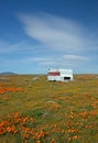 Abandoned camper in California Golden Orange Poppy field during super bloom spring in southern California high desert Royalty Free Stock Photo