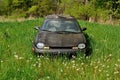 Abandoned car in field Royalty Free Stock Photo