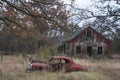 Abandoned car in front of a rustic farm house. Ai generated Royalty Free Stock Photo