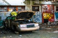 Abandoned car Graffiti building in flint michigan