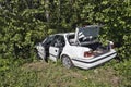Abandoned car on the roadside forest after accident Royalty Free Stock Photo
