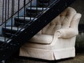 Abandoned chair under fire exit stairwell Royalty Free Stock Photo