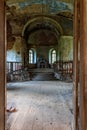 Abandoned church in Latvia, Galgauska, view through the entrance door to the interior Royalty Free Stock Photo