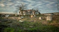 Abandoned church ruin and cemetery overgrown landscape Royalty Free Stock Photo