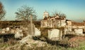 Abandoned church ruin and cemetery overgrown landscape Royalty Free Stock Photo