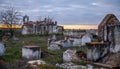 Abandoned church ruin and cemetery overgrown landscape Royalty Free Stock Photo