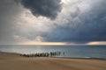 Stormy clouds over the sea. Old wooden pier on the shore. Royalty Free Stock Photo