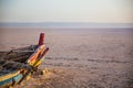 Abandoned colourful Boat in desert at dawn Royalty Free Stock Photo