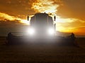 Abandoned combine harvest wheat in the middle of a farm field. Morning yellow wheat field on the sunset cloudy orange sky. Royalty Free Stock Photo