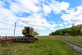 Abandoned combine harvester. Rusty spoiled combine harvester.