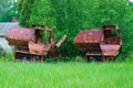 Abandoned combine harvesters at former farm yard of state farm in resettled village of Pogonnoye in Chernobyl exclusion zone Royalty Free Stock Photo