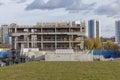 Abandoned construction of a large concrete building. Stopped construction of an office building due to lack of funding