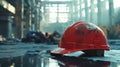 Abandoned construction site featuring a dirty red hard hat Royalty Free Stock Photo