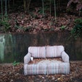 Abandoned Couch / Sofa on an Urban Sidewalk. Royalty Free Stock Photo