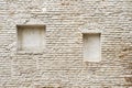 Abandoned cracked brick stucco wall with a stucco frame Royalty Free Stock Photo