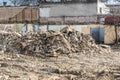 Remains of hurricane or earthquake aftermath disaster damage on ruined old houses with collapsed roof and wall