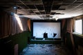 Abandoned and damaged interior of a movie theatre with stage Royalty Free Stock Photo