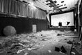 Abandoned and damaged interior of a movie theatre with stage Royalty Free Stock Photo
