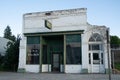 Abandoned, decaying drug store building sits abandoned on the main street of the small town Royalty Free Stock Photo