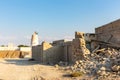 Abandoned demolished building of Al Jazirah Al Hamra town in United Arab Emirates, old ruins of haunted pearl village