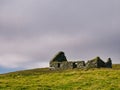 An abandoned, derelict croft / farm house near Sandwick on the island of Unst in Shetland, Scotland, UK